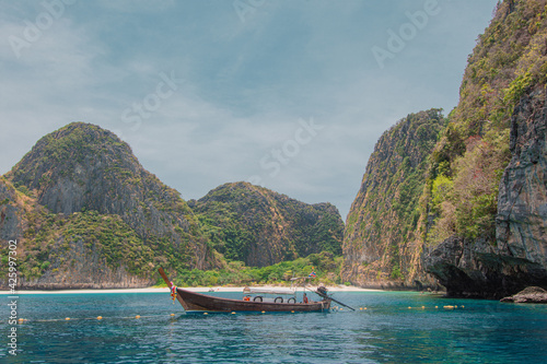 Krabi Thailand. March 23, 2021 Long boat and blue water at Maya bay in Phi Phi Island