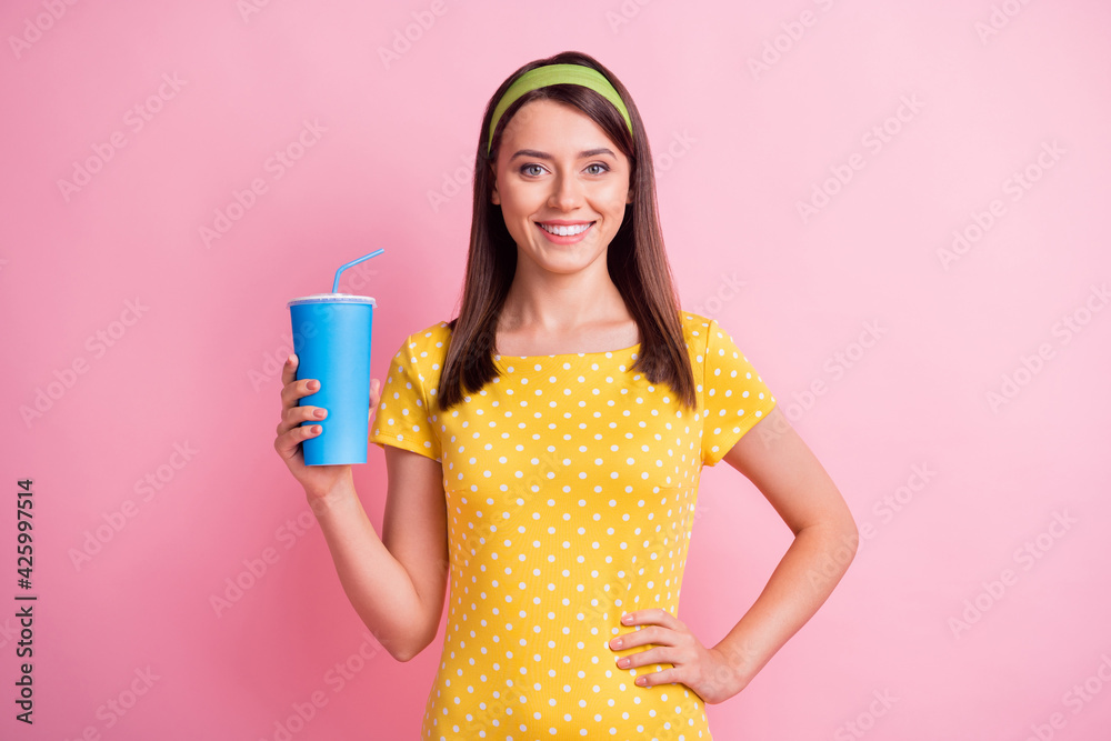 Photo of young attractive smiling good mood positive happy lovely girl hold cola soda isolated on pink color background