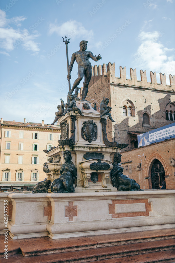 A statue in front of Fountain of Neptune, Bologna