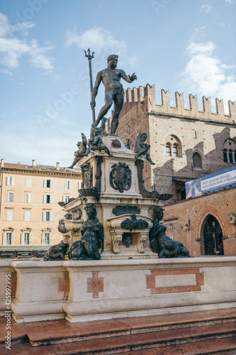 A statue in front of Fountain of Neptune, Bologna