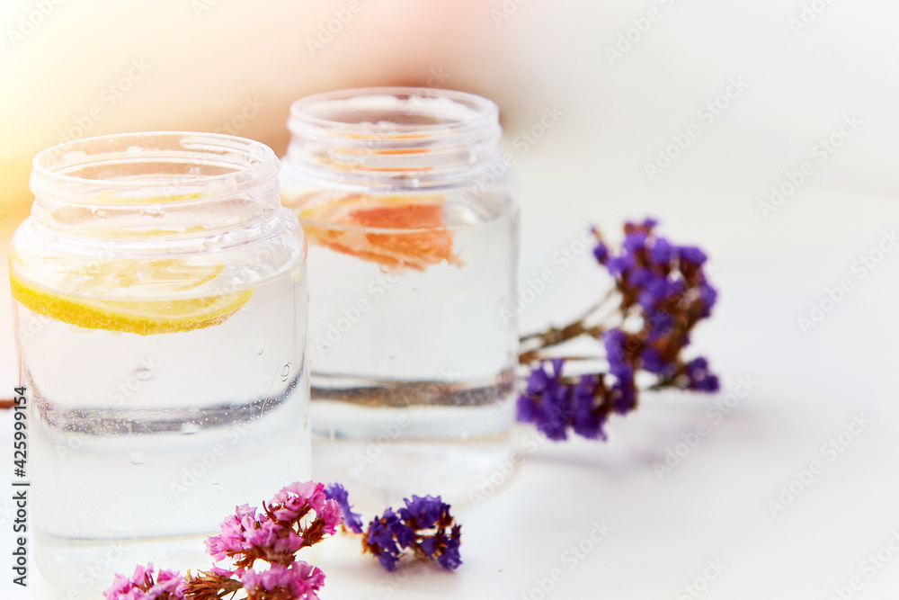 Hard seltzer with grapefruit and lemon. Homemade summer cocktails. Summer background, copy space Hard seltzer with grapefruit and lemon. Homemade summer cocktails. Summer background, copy space
