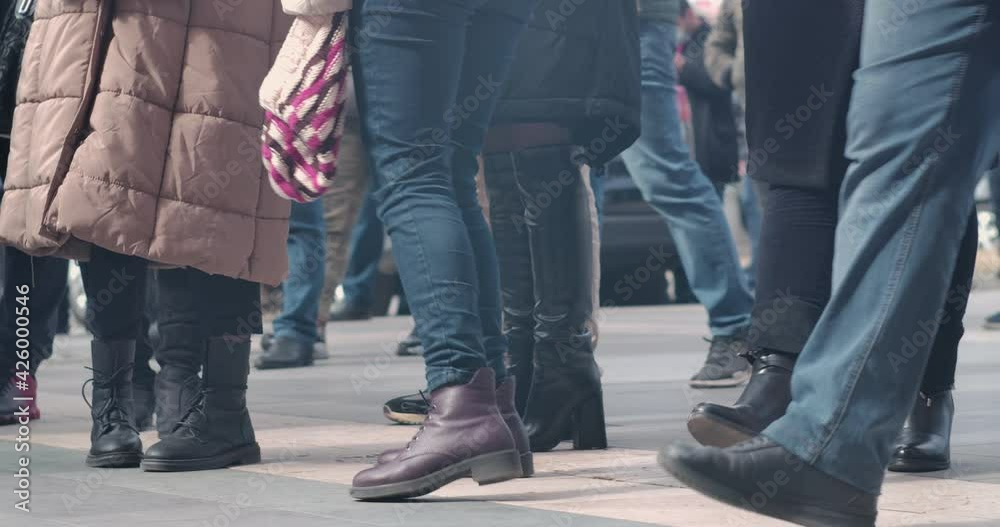People walking on the street. Crowd of people on the street dressed in winter clothes. People walking on the street. Crowd of people on the street dressed in winter clothes.