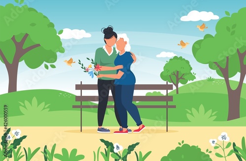 Teenage girl hugging her mother outdoor in nature on sunny day. Woman hugging her mother. Family love. Mothers Day greeting card. Mom and daughter hug together. Family relationship concept.