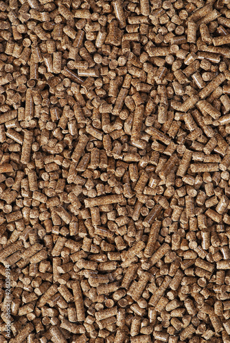Wood pellets - close-up, background, cheap energy.