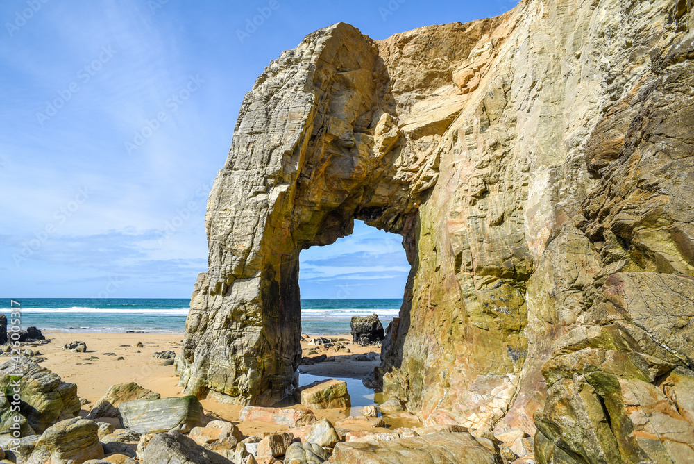Beautiful sea landscape, rocky arch on the ocean coast in France.