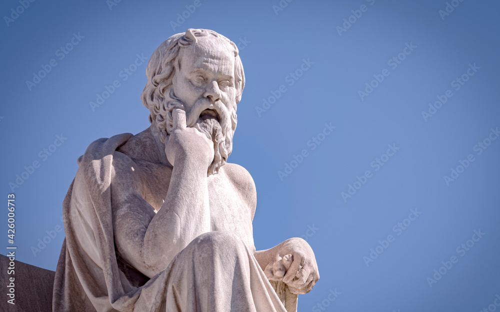 Socrates the ancient Greek philosopher and thinker white marble statue under blue sky, space for your text Socrates the ancient Greek philosopher and thinker white marble statue under blue sky, space for your text
