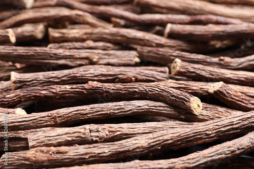 Dried sticks of liquorice root as background, closeup © New Africa
