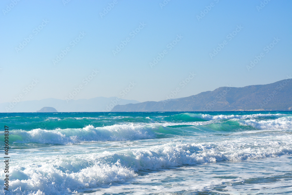 Beautiful sea waves, sky and mountains. Travel to paradise. Vacation , summer concept