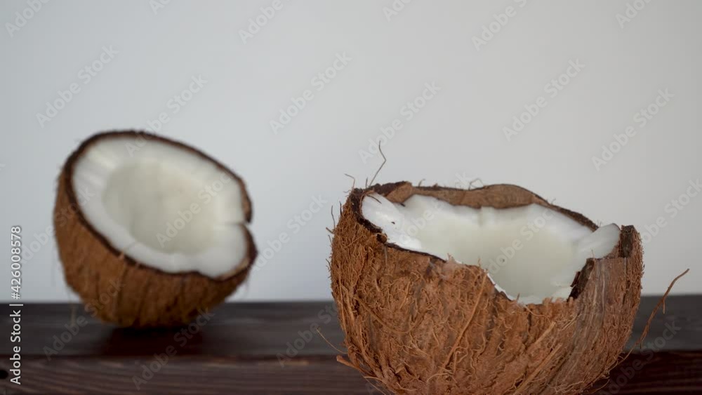 cracked coconut on a white background. circular motion