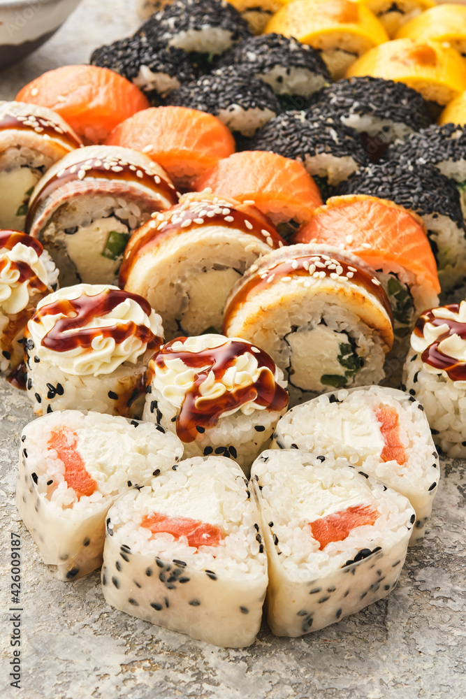 Japanese sushi food. Maki ands rolls with tuna, salmon, shrimp, crab and avocado. Assorted sushi Japanese sushi food. Maki ands rolls with tuna, salmon, shrimp, crab and avocado. Assorted sushi