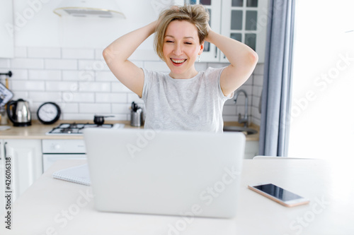 happy woman working on laptop