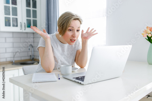 emotional woman working on laptop