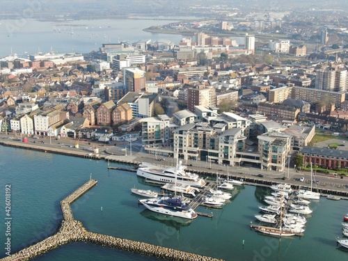 aerial view of Poole harbour showing the marina and town