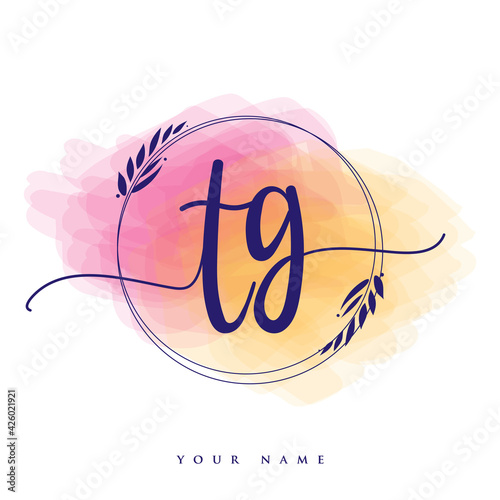 TG Initial handwriting logo. Hand lettering Initials logo branding, Feminine and luxury logo design isolated on colorful watercolor background.