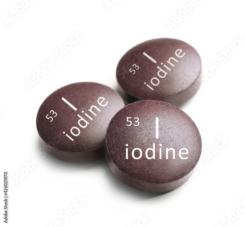 Iodine pills on white background. Mineral element
