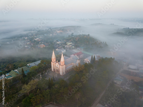 TanHoa church in misty morning, BaoLoc, VietNam. photo