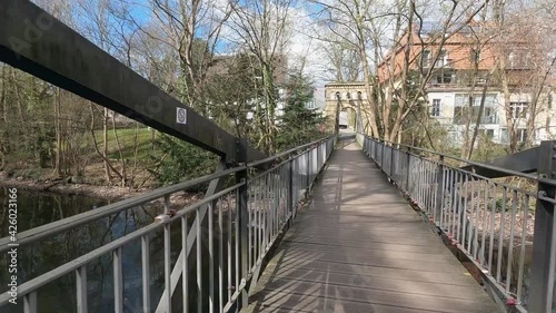 Ride over a narrow historical bridge over the river Oker in Braunschweig photo