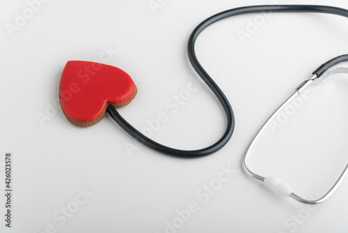 Stethoscope and red heart. Follow your heart. White background