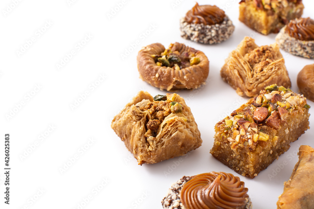 Assortment of Ramadan dessert baklava and dates isolated on white background Assortment of Ramadan dessert baklava and dates isolated on white background