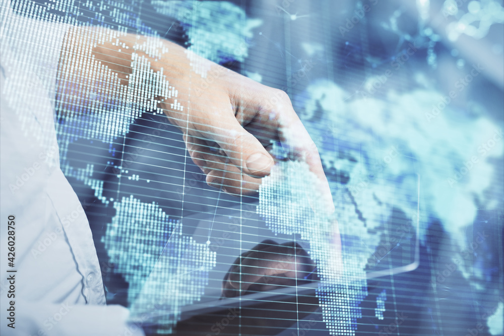 Double exposure of man's hands holding and using a phone and international business theme drawing. Double exposure of man's hands holding and using a phone and international business theme drawing.