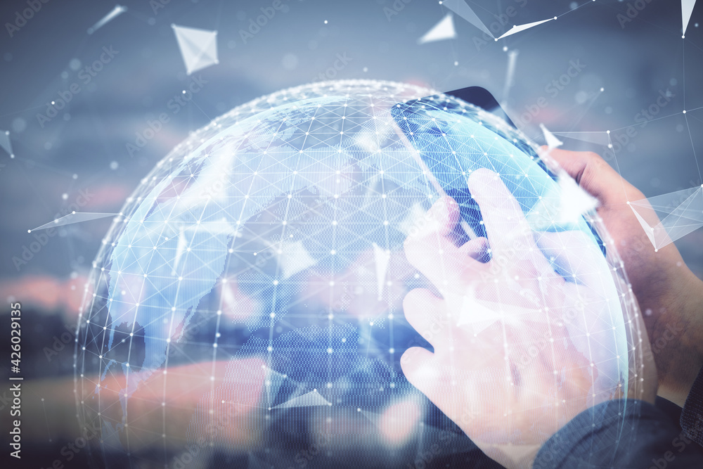 Double exposure of man's hands holding and using a phone and international business theme drawing.