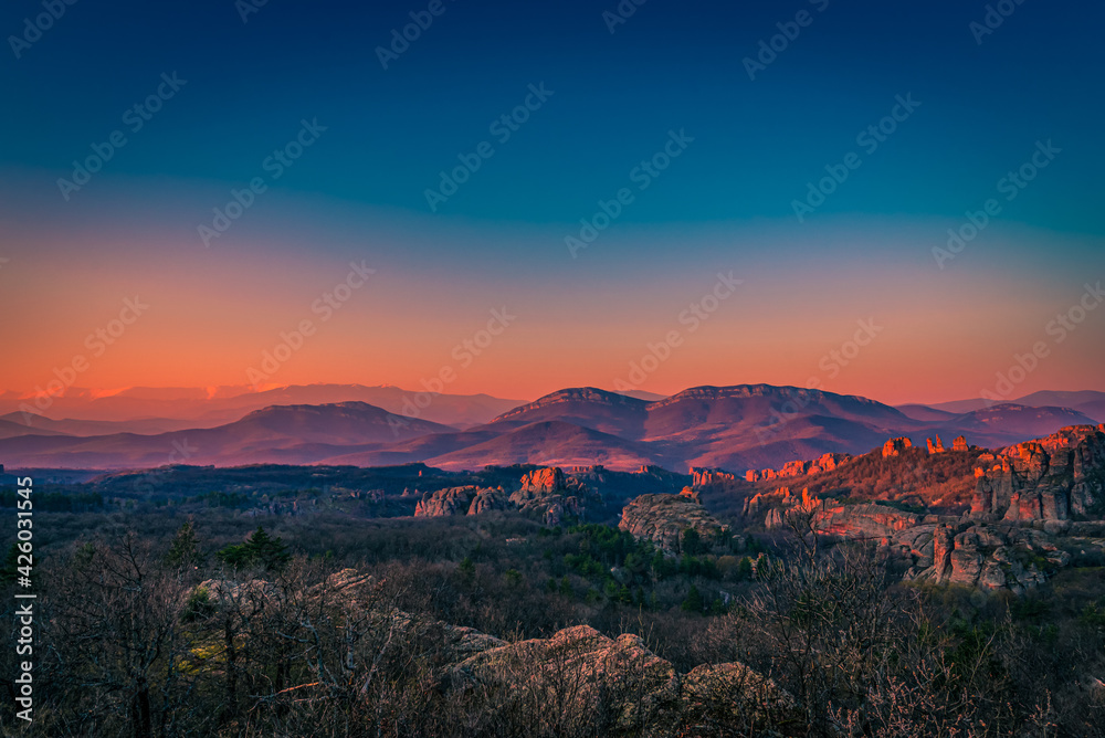 Beautiful sunrise over the mountains \Warm sunrise in Belogradchik rocks, Bulgaria 