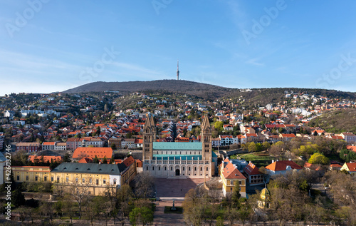 Amazing aerial cityscape about the Pecs city historical downtown and basilica in springtime. Unique medieval mood city in Hungary