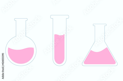 Set of glass flasks with pink liquid 