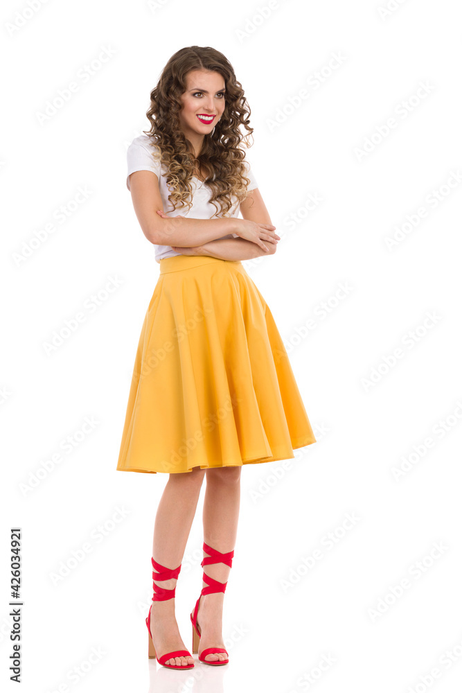 Smiling Beautiful Woman Is Standing With Arms Crossed And Looking Away Smiling Beautiful Woman Is Standing With Arms Crossed And Looking Away