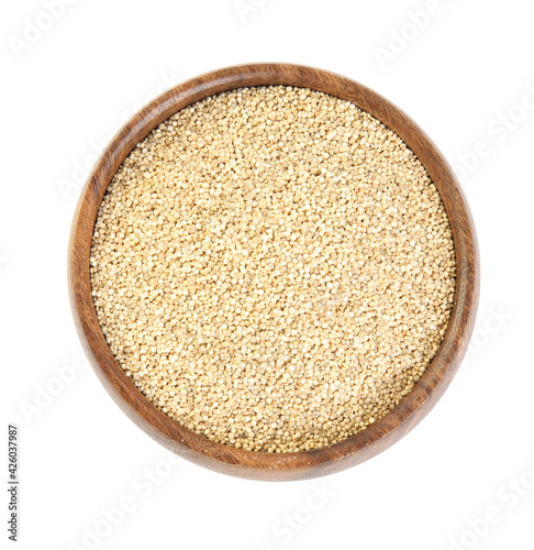 Wooden bowl with raw quinoa isolated on white, top view