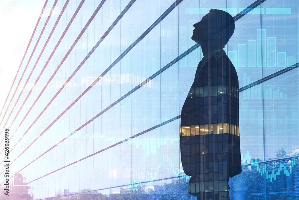 Fototapeta premium Double exposure of young businessman and modern building