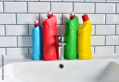 Wallpaper Mural Detergent bottles and detergent spray cleaner in the bathroom on washbasin. Household for cleaning and washing. Concentrated and anti-bacterial liquids for dishwasher. Detergents and laundry concept Torontodigital.ca