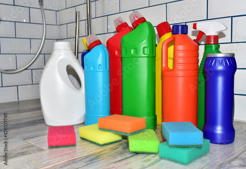 Detergent bottles, sponge for washing and detergent spray cleaner. Household for cleaning and washing. Concentrated and anti-bacterial liquids for dishwasher. Detergents and laundry concept