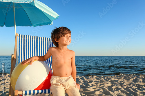Cute little boy on sea beach