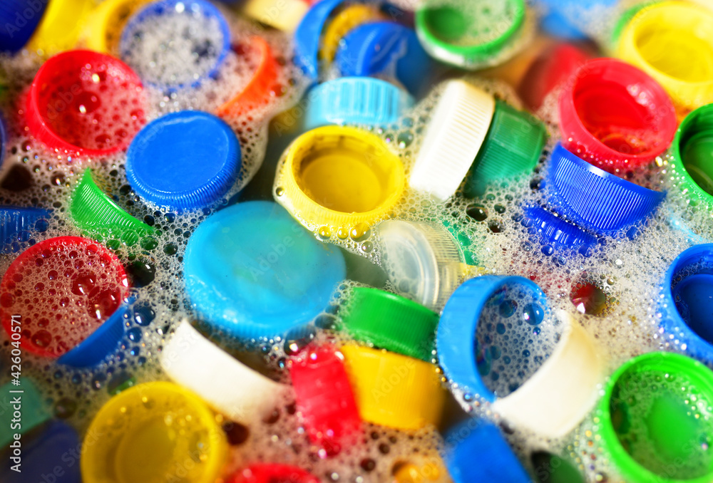 Recycling of plastic bottle caps. Cap material is recyclable.Remove lids from plastic bottles