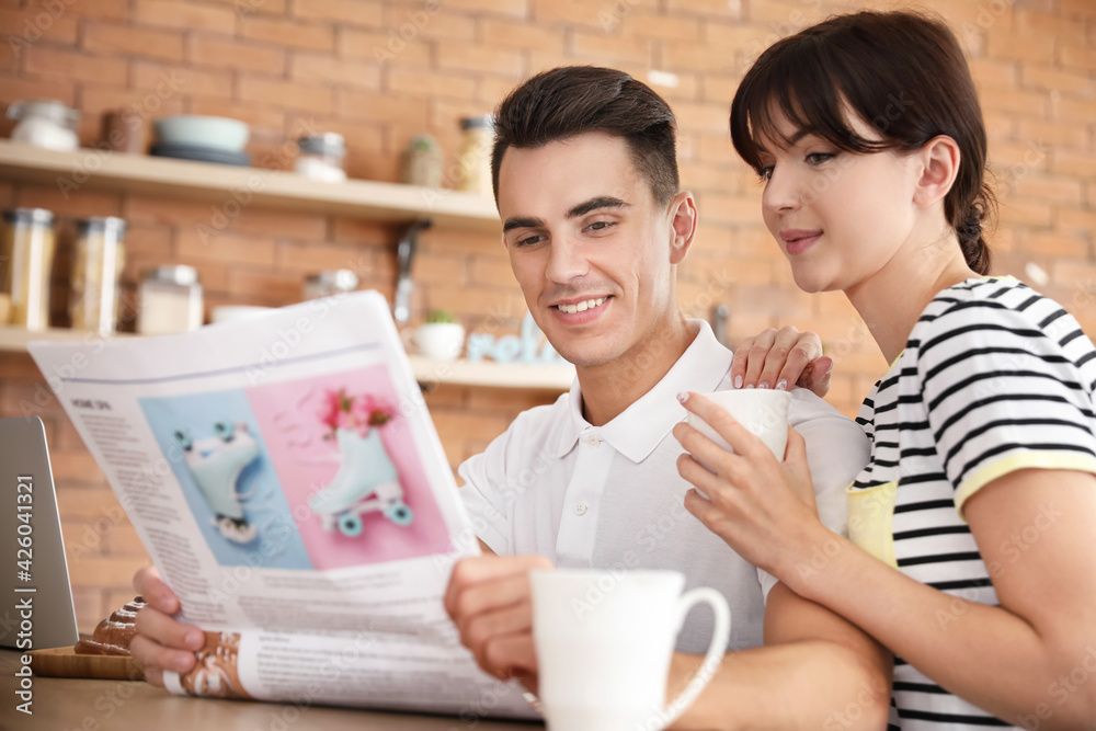 Morning of happy young couple in kitchen Morning of happy young couple in kitchen