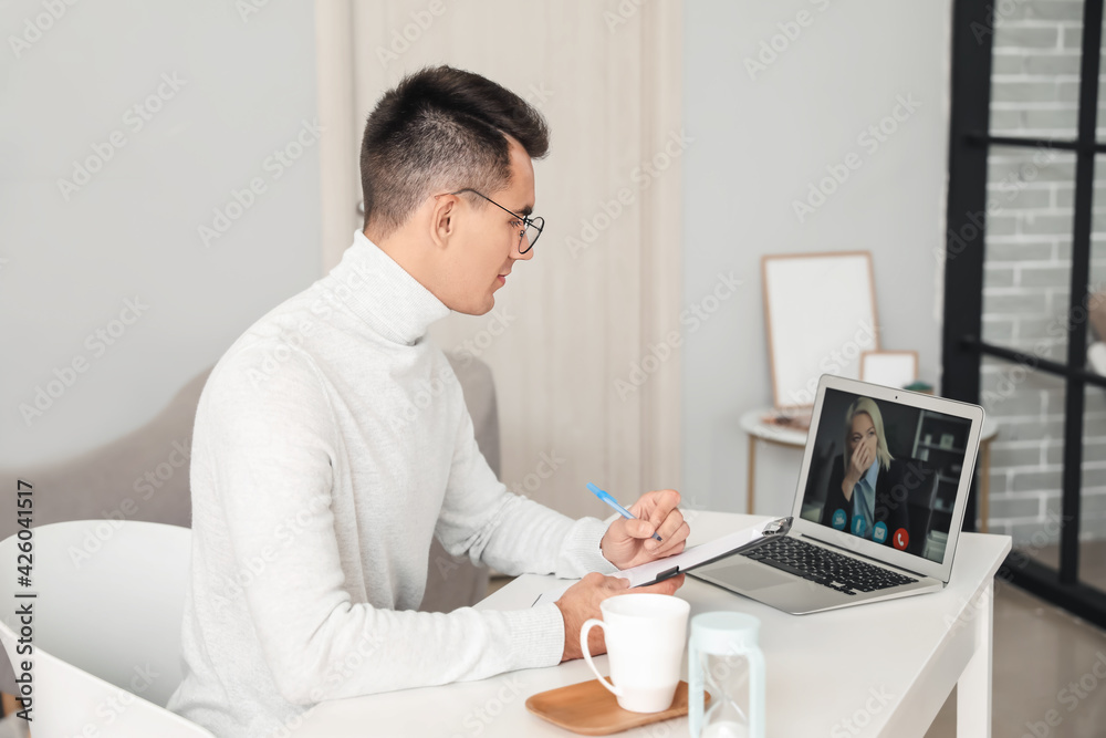 Psychologist working with patient online in office Psychologist working with patient online in office