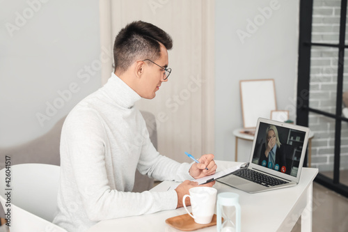 Psychologist working with patient online in office © Pixel-Shot