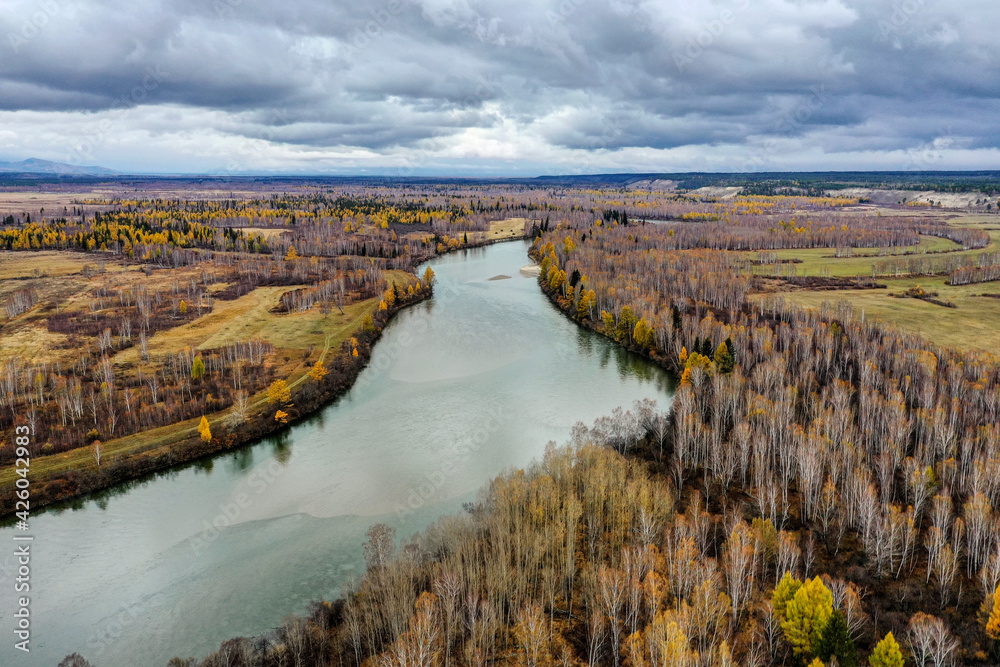 Eastern Sayans in autumn. Tunka valley before the rain. Irkut River.