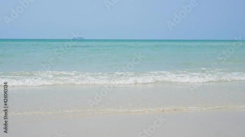 Vacations and summerTrip. Beautiful white sand beach for tours travel in the holiday. The shadow of a tree leading to the sea Summer nature view.  Clip and footage photo