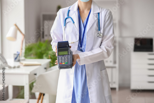 Doctor with payment termina...