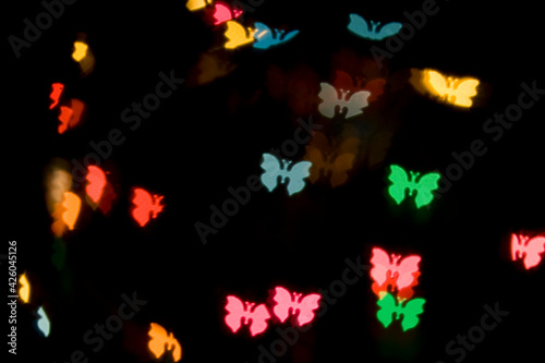 Abstract colorful rainbow defocused Butterfly Shape bokeh texture. 