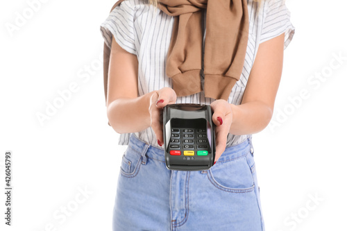 Young woman with payment terminal on white background