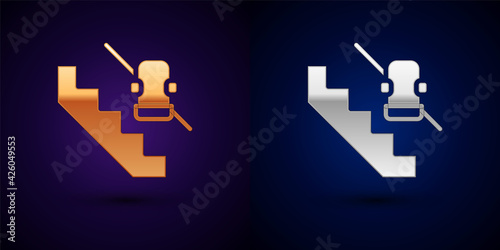 Gold and silver Disabled access elevator lift escalator icon isolated on black background. Movable mechanical chair platform for handicapped human. Vector