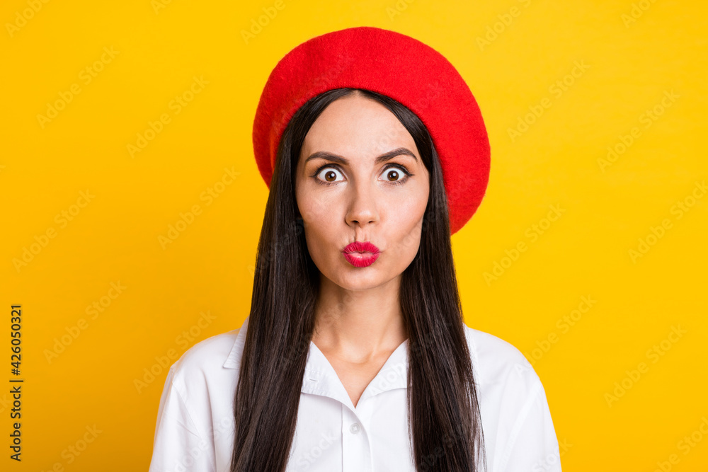 Photo of pretty positive young lady kiss lips look camera isolated on vibrant yellow color background Photo of pretty positive young lady kiss lips look camera isolated on vibrant yellow color background