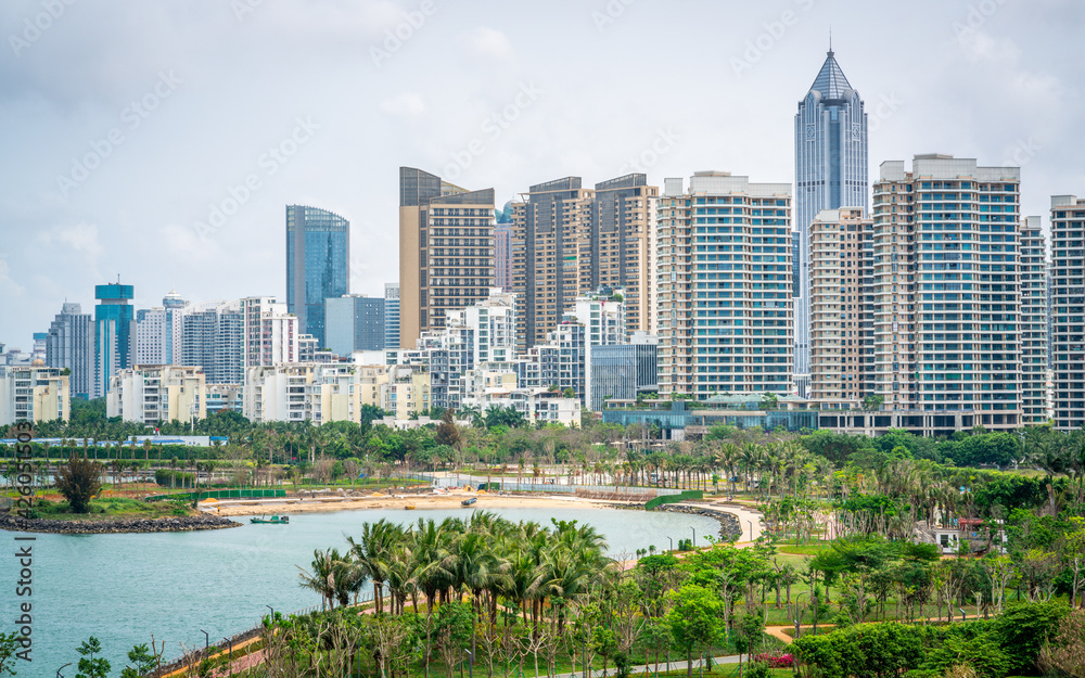 Obraz premium Haikou city skyline with sea and shoreline on overcast weather day Haikou Hainan China