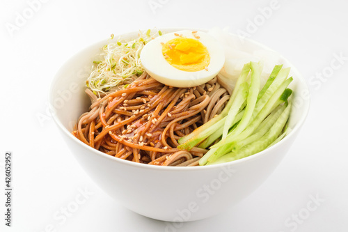 Seasoned soba noodles on a white background