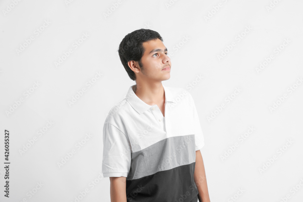 young indian boy showing expression on white background young indian boy showing expression on white background