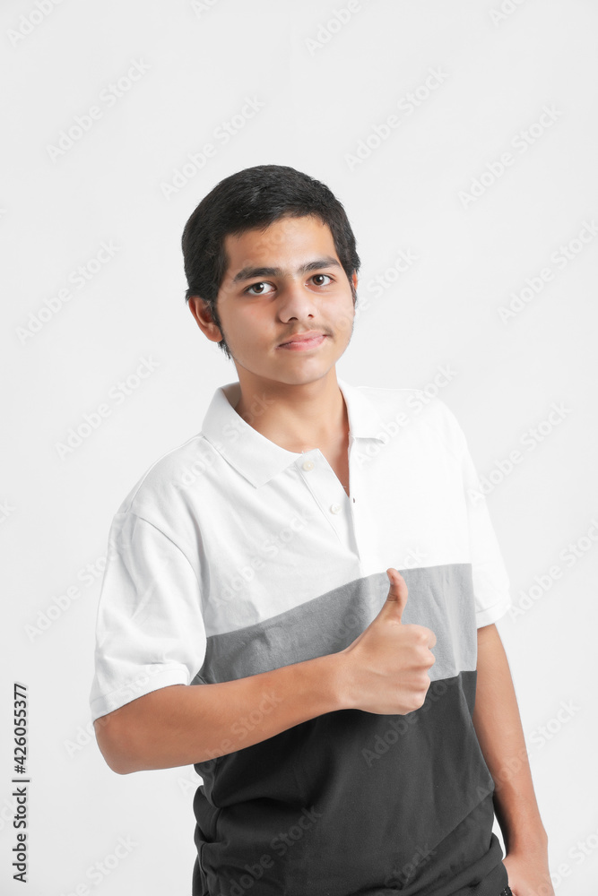 young indian boy showing expression on white background young indian boy showing expression on white background