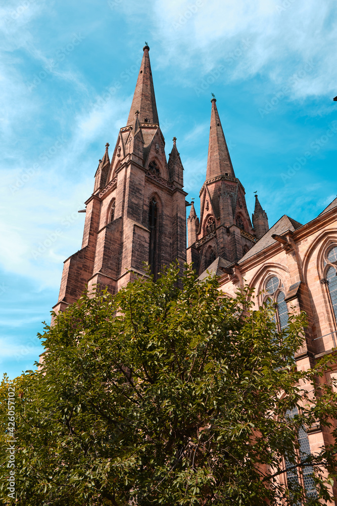 Low angle view at the Elisabeth church in Marburg on a sunny day with blue sky